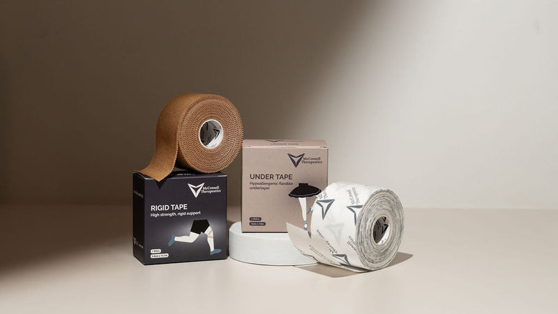 McConnell Therapeutics Rigid Tape and Under Tape hypoallergenic under layer, showing the layered taping system for skin protection and support