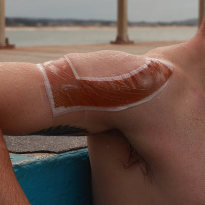 McConnell Tape Shield applied over shoulder strapping for waterproof protection during swimming and rehabilitation