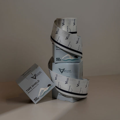 McConnell Therapeutics Tape Shield boxes and roll displayed together highlighting long-lasting waterproof durability