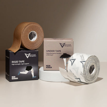 McConnell Rigid and Under Tape combo pack showing stylised zinc oxide and acrylic adhesive rolls